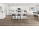 Elegant kitchen featuring white cabinetry, a central island, and sleek stainless steel appliances at 210 Sharon Ln, Loganville, GA 30052