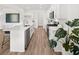 Open-concept kitchen with an island, stainless steel appliances, and abundant natural light at 210 Sharon Ln, Loganville, GA 30052