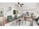 Open living area features neutral decor, modern furnishings, and a view of the kitchen at 210 Sharon Ln, Loganville, GA 30052