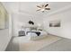 Stylish main bedroom with modern decor, tray ceiling, and ample natural light at 210 Sharon Ln, Loganville, GA 30052