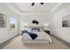Inviting main bedroom with neutral decor, tray ceilings, and scenic outdoor views at 210 Sharon Ln, Loganville, GA 30052