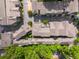 A high angle view of a community with unique rooflines and lush green trees at 262 Southerland Ne Ter, Atlanta, GA 30307