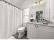 This bathroom features a shower with a white curtain, white vanity, and tile floor at 262 Southerland Ne Ter, Atlanta, GA 30307