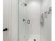 Modern bathroom features glass shower door and white subway tiles with hexagon-shaped floor tiles at 262 Southerland Ne Ter, Atlanta, GA 30307