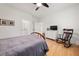 This bedroom has hardwood floors, ceiling fan, and a furniture set at 262 Southerland Ne Ter, Atlanta, GA 30307
