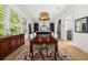 Charming dining room with an open layout, hardwood floors, and views into the adjacent chef's kitchen at 262 Southerland Ne Ter, Atlanta, GA 30307