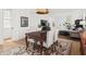Cozy dining room with a wooden table, upholstered chairs, and access to the living area at 262 Southerland Ne Ter, Atlanta, GA 30307