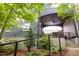 Inviting covered front porch with comfortable seating and stylish railing, perfect for relaxing outdoors at 262 Southerland Ne Ter, Atlanta, GA 30307