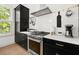 Well-appointed kitchen featuring stainless steel appliances, custom cabinetry, and bright subway tile backsplash at 262 Southerland Ne Ter, Atlanta, GA 30307