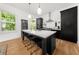 Open concept kitchen with large center island, stainless steel appliances, and ample cabinet space at 262 Southerland Ne Ter, Atlanta, GA 30307