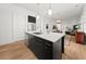 Stylish kitchen with island, stainless appliances, sleek cabinets, and an open layout to the living spaces at 262 Southerland Ne Ter, Atlanta, GA 30307