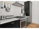 Modern kitchen with stainless steel appliances, white countertops, subway tile backsplash, and custom cabinets at 262 Southerland Ne Ter, Atlanta, GA 30307
