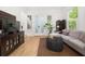 Bright living room featuring a comfortable sofa, hardwood floors, and large windows at 262 Southerland Ne Ter, Atlanta, GA 30307