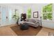 Inviting living room with a plush sofa, natural light, and elegant decor at 262 Southerland Ne Ter, Atlanta, GA 30307