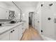 Bright main bathroom with double vanity, glass shower, and access to the walk-in closet at 262 Southerland Ne Ter, Atlanta, GA 30307
