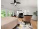 Bright main bedroom boasts vaulted ceilings, modern fan, and sliding barn door to en suite bathroom at 262 Southerland Ne Ter, Atlanta, GA 30307