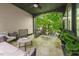 Spacious porch with outdoor seating overlooks lush greenery, perfect for relaxation and enjoying the outdoors at 262 Southerland Ne Ter, Atlanta, GA 30307