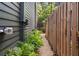 Side yard with wood fence, siding, greenery and rock landscaping at 262 Southerland Ne Ter, Atlanta, GA 30307