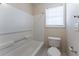 The bathroom has a shower-tub combination with toilet and towel rack at 538 Shadowmoore Dr, Riverdale, GA 30274