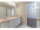 Double sink vanity with tile floors featured in this bathroom, plus doorway to bedroom at 538 Shadowmoore Dr, Riverdale, GA 30274