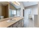 Bright bathroom with double sinks, soaking tub, and glass shower at 538 Shadowmoore Dr, Riverdale, GA 30274