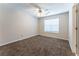 Bedroom with neutral paint, carpet, ceiling fan, and a window providing natural light at 538 Shadowmoore Dr, Riverdale, GA 30274