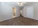 Bedroom featuring neutral paint, carpet, ceiling fan, and access to the bathroom at 538 Shadowmoore Dr, Riverdale, GA 30274
