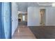 Inviting entryway with wood and carpet flooring that leads to a spacious living area and kitchen at 538 Shadowmoore Dr, Riverdale, GA 30274