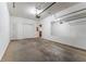 Spacious single-car garage with automatic door opener and plenty of room for storage at 538 Shadowmoore Dr, Riverdale, GA 30274