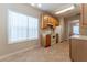 Eat-in kitchen with tile floors, wooden cabinets and white appliances at 538 Shadowmoore Dr, Riverdale, GA 30274