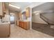 Open concept kitchen featuring tile flooring and wooden cabinets, looking to the staircase at 538 Shadowmoore Dr, Riverdale, GA 30274