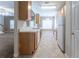 Traditional style kitchen with tile floors, white appliances and wooden cabinets at 538 Shadowmoore Dr, Riverdale, GA 30274