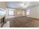 Open-concept living room seamlessly connects with a cozy kitchen featuring a view of the living area at 538 Shadowmoore Dr, Riverdale, GA 30274