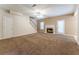 Spacious living room with a fireplace, and staircase that adds architectural interest to the room at 538 Shadowmoore Dr, Riverdale, GA 30274