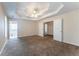Large carpeted main bedroom with ceiling fan, ensuite bathroom, and walk-in closet at 538 Shadowmoore Dr, Riverdale, GA 30274