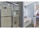 Bright bathroom features a tub and walk-in shower at 575 Chapel Walk Ln, Lawrenceville, GA 30045