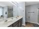 Large bathroom with double sink vanity and shower with glass doors at 575 Chapel Walk Ln, Lawrenceville, GA 30045