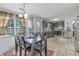 Spacious kitchen and dining area with updated appliances, gray cabinetry and stone countertops at 575 Chapel Walk Ln, Lawrenceville, GA 30045