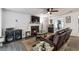 Comfortable living room features a fireplace, TV, ceiling fan, and leather reclining sofa at 575 Chapel Walk Ln, Lawrenceville, GA 30045