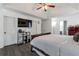 This bedroom features a large window and gray hardwood-style flooring at 575 Chapel Walk Ln, Lawrenceville, GA 30045