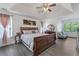 Spacious main bedroom features a trey ceiling, ceiling fan, and hardwood-style floors at 575 Chapel Walk Ln, Lawrenceville, GA 30045