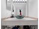 Modern bathroom featuring a unique glass bowl sink and stylish vanity with ample storage space at 795 Hammond Dr # 505, Atlanta, GA 30328