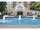 Luxurious building entrance with water feature and manicured landscaping at 795 Hammond Dr # 505, Atlanta, GA 30328