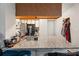 Kitchen featuring granite countertop, stainless steel sink, and wood cabinets at 795 Hammond Dr # 505, Atlanta, GA 30328