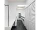 Bright laundry room offering multiple machines and folding table perfect for residents at 795 Hammond Dr # 505, Atlanta, GA 30328