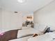 Spacious living room featuring a sectional sofa, hardwood floors, and kitchen view at 795 Hammond Dr # 505, Atlanta, GA 30328