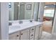 Bathroom showcasing double sinks and a view into the bedroom, blending style with everyday function at 230 Ryan Ln, Covington, GA 30014