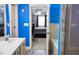 Bright bathroom offers double vanity, walk in shower and soaking tub, with a bedroom view at 230 Ryan Ln, Covington, GA 30014
