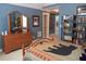 Bedroom with dresser and bookshelves offers storage and enhances the room's character and functionality at 230 Ryan Ln, Covington, GA 30014