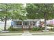 Charming home with a welcoming front porch and mature trees, offering curb appeal at 230 Ryan Ln, Covington, GA 30014